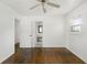 Bright bedroom featuring wood floors, white walls, and a ceiling fan at 3501 Wesley Chapel Rd, Decatur, GA 30034