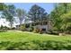 Inviting exterior featuring a well-maintained lawn and charming white-painted brick at 3501 Wesley Chapel Rd, Decatur, GA 30034