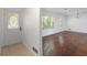 Foyer with decorative door leads to living area featuring hardwood floors and natural light at 3501 Wesley Chapel Rd, Decatur, GA 30034