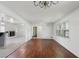Spacious living area with wood floors, white walls, fireplace, and abundant natural light at 3501 Wesley Chapel Rd, Decatur, GA 30034