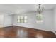 Bright living room with hardwood floors, natural light, and neutral walls at 3501 Wesley Chapel Rd, Decatur, GA 30034