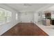 Open floor plan with hardwood floors, connecting to a kitchen area with modern island at 3501 Wesley Chapel Rd, Decatur, GA 30034