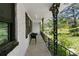 Outdoor porch area with dark metal rails and a view of the surrounding greenery at 3501 Wesley Chapel Rd, Decatur, GA 30034