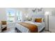 Comfortable bedroom with natural light, a stylish bed, and decorative wall art at 4220 Provenance Trl, Cumming, GA 30028