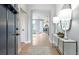 Inviting entryway with hardwood floors, elegant console table with lamps, and neutral wall color at 4220 Provenance Trl, Cumming, GA 30028