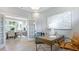 Elegant home office with a wooden desk, modern art, and a view into the dining area at 4220 Provenance Trl, Cumming, GA 30028