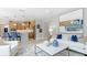 Open-concept living room and kitchen design, featuring modern decor and stainless steel appliances at 4220 Provenance Trl, Cumming, GA 30028