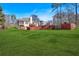 Large backyard with a covered patio and expansive lawn, ideal for outdoor entertaining at 46 Centerport Dr, White, GA 30184