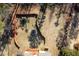 Aerial view of a fenced-in backyard with a play set, trampoline, and plenty of space at 46 Centerport Dr, White, GA 30184