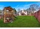 Spacious backyard with a wooden playset, swing set, and trampoline perfect for Gathering fun at 46 Centerport Dr, White, GA 30184