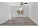 Finished basement with wood-look flooring, large window, and white walls at 46 Centerport Dr, White, GA 30184