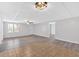 Spacious basement area with wood-look flooring, large window and a transitional tile accent at 46 Centerport Dr, White, GA 30184