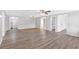 Open basement space with wood-look flooring, ceiling fans and multiple doorways at 46 Centerport Dr, White, GA 30184