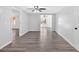 Bright basement space with wood-look flooring, neutral walls, and a ceiling fan at 46 Centerport Dr, White, GA 30184