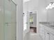 Bathroom features glass-enclosed shower, dual vanity sinks, and modern lighting at 46 Centerport Dr, White, GA 30184