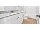 This bathroom features a granite countertop, white cabinets, and a toilet and shower/tub combo at 46 Centerport Dr, White, GA 30184