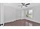 Bedroom with a ceiling fan, double closet, and hardwood floors at 46 Centerport Dr, White, GA 30184
