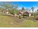 Charming brick home with well-maintained landscaping, a two-car garage, and mature trees at 46 Centerport Dr, White, GA 30184