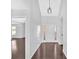 A bright foyer featuring hardwood floors and modern lighting at 46 Centerport Dr, White, GA 30184