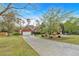 Charming single Gathering brick home with a long driveway and well maintained landscaping at 46 Centerport Dr, White, GA 30184