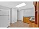 Kitchenette with white refrigerator, oak cabinets, granite countertop, and tile flooring at 46 Centerport Dr, White, GA 30184