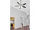 Open-concept living room featuring high ceilings and a modern ceiling fan at 46 Centerport Dr, White, GA 30184