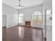 Bright living room with fireplace, large windows, vaulted ceiling, and dark hardwood floors at 46 Centerport Dr, White, GA 30184