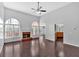 Bright living room featuring hardwood floors, vaulted ceiling, fireplace, and lots of natural light at 46 Centerport Dr, White, GA 30184
