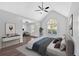 Spacious main bedroom with large windows, hardwood floors, vaulted ceilings, and sitting area at 46 Centerport Dr, White, GA 30184