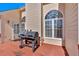 Outdoor deck with a grill, perfect for outdoor cooking and entertaining with arched windows at 46 Centerport Dr, White, GA 30184