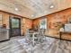 Cozy dining area featuring a table for four, wood accents, and natural light streaming through a window at 1166 Upper Sweetwater Se Trl, White, GA 30184