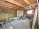 The interior of this storage shed features wood walls and ceiling and contains tools and hardware at 1166 Upper Sweetwater Se Trl, White, GA 30184