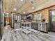 Modern kitchen with stainless steel appliances, dark wood cabinetry, and a convenient kitchen island at 1166 Upper Sweetwater Se Trl, White, GA 30184