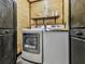 Functional laundry room featuring a washer, dryer, and storage cabinets, perfect for household chores at 1166 Upper Sweetwater Se Trl, White, GA 30184