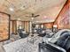 Open living area features luxury vinyl plank floors, wood walls and ceiling, and recessed lighting at 1166 Upper Sweetwater Se Trl, White, GA 30184