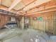 Interior view of an unfinished outbuilding with plywood walls and a dirt floor at 1166 Upper Sweetwater Se Trl, White, GA 30184