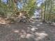 Property featuring a dirt driveway, a house, and a building further away at 1166 Upper Sweetwater Se Trl, White, GA 30184