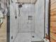 Elegant shower with white tile, a modern shower head, and glass door, enhancing the bathroom's design at 1166 Upper Sweetwater Se Trl, White, GA 30184