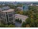The aerial view captures the buildings nestled among lush trees, near convenient parking areas at 1250 Parkwood Cir # 2312, Atlanta, GA 30339