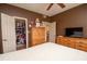 Bedroom has a closet with an open door and an entertainment center with a modern television at 1250 Parkwood Cir # 2312, Atlanta, GA 30339