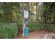 Dog waste station with trash receptacle on the landscaped condo grounds at 1250 Parkwood Cir # 2312, Atlanta, GA 30339