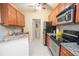 Well-lit kitchen features granite countertops and stainless steel appliances at 1250 Parkwood Cir # 2312, Atlanta, GA 30339