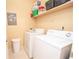 Convenient laundry room equipped with a washer and dryer, plus extra storage space at 1250 Parkwood Cir # 2312, Atlanta, GA 30339