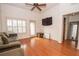 Spacious living room with hardwood floors, ceiling fan, and plenty of natural light at 1250 Parkwood Cir # 2312, Atlanta, GA 30339