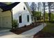 Exterior view of the home highlighting landscaping, walkway, and architectural details at 1632 Oleander Sw Dr, Lilburn, GA 30047