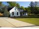 Inviting home featuring a well-manicured lawn, a spacious driveway, and tasteful landscaping, enhancing curb appeal at 1632 Oleander Sw Dr, Lilburn, GA 30047