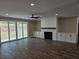 Spacious living room with fireplace, built-in cabinets, and sliding glass doors to the backyard at 1632 Oleander Sw Dr, Lilburn, GA 30047