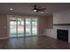 Cozy living room with fireplace, sliding glass doors and a view of the outdoor area at 1632 Oleander Sw Dr, Lilburn, GA 30047