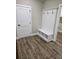 Functional mudroom featuring a built-in bench with storage and hooks, enhancing organization and convenience at 1632 Oleander Sw Dr, Lilburn, GA 30047