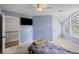 A cozy bedroom featuring a car themed bed, natural light from multiple windows, and light blue walls at 1670 Nordic Trce, Marietta, GA 30068
